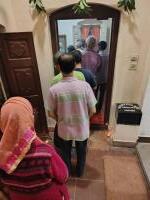 Sadhakas queuing to offer pranams in the Samadhi room